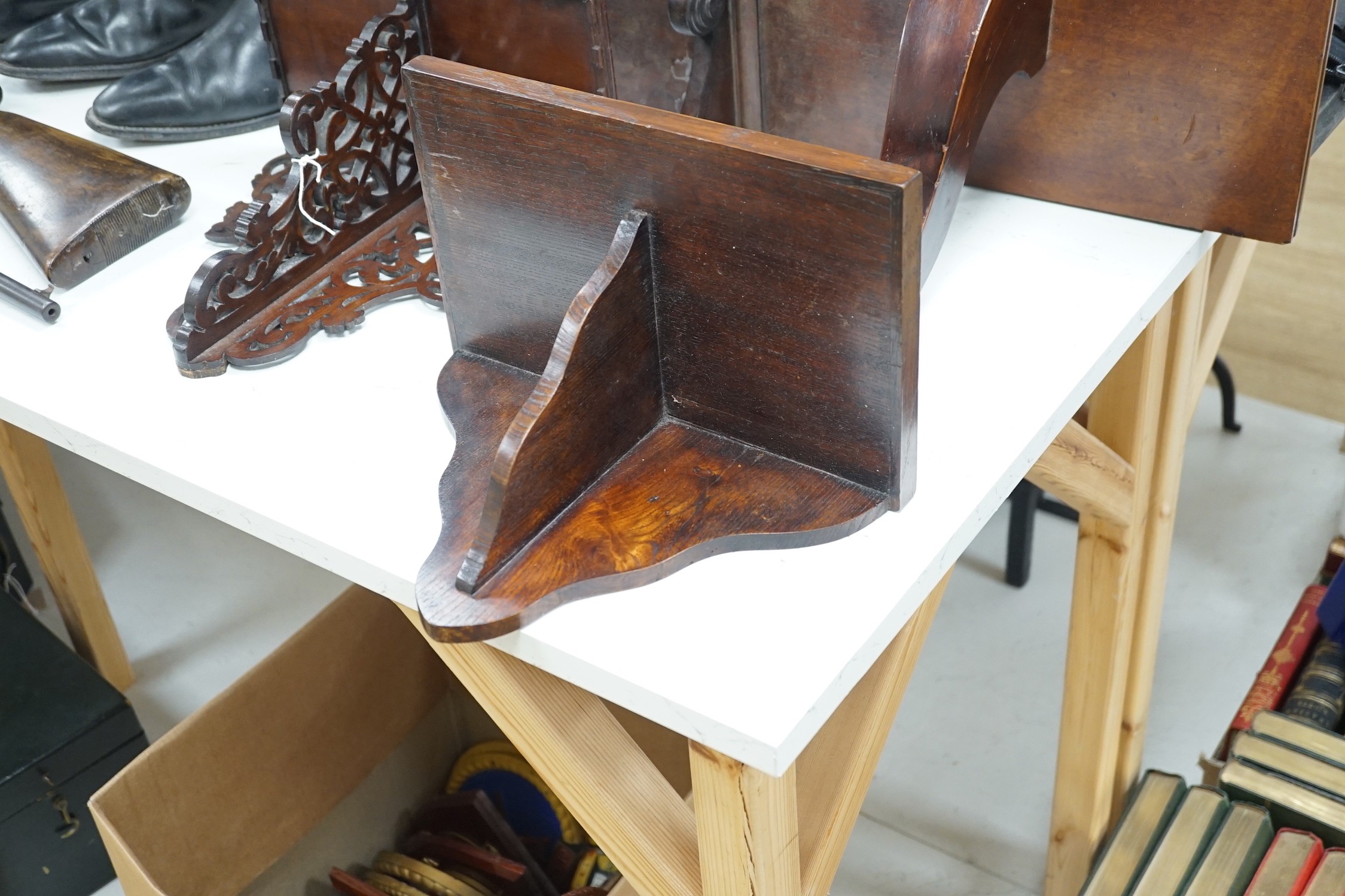 Four carved mahogany or oak wall brackets, largest 34x39cm